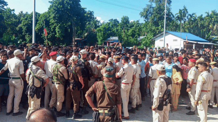 Police personnel try to stop as protestors are enraged over the shifting of five accused in connection with the death of singer Zubeen Garg to the newly-constructed prison in Baksa on 15 October 2025. | ANI