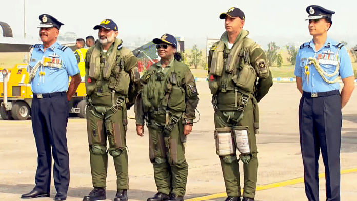 In this screenshot from a video posted on Oct. 29, 2025, President Droupadi Murmu with Chief of the Air Staff Air Chief Marshal AP Singh, second from left, and others before she takes a sortie in Rafale fighter jet, at Air Force Station in Haryana's Ambala | PTI