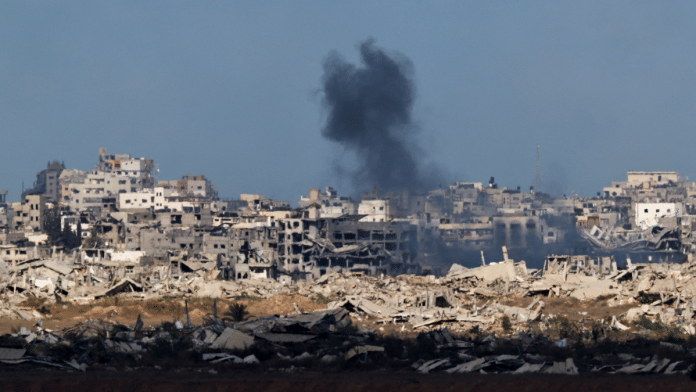 Smoke rises from Gaza after an explosion, as seen from the Israeli side of the border with Gaza on 6 October 2025. | Amir Cohen | Reuters
