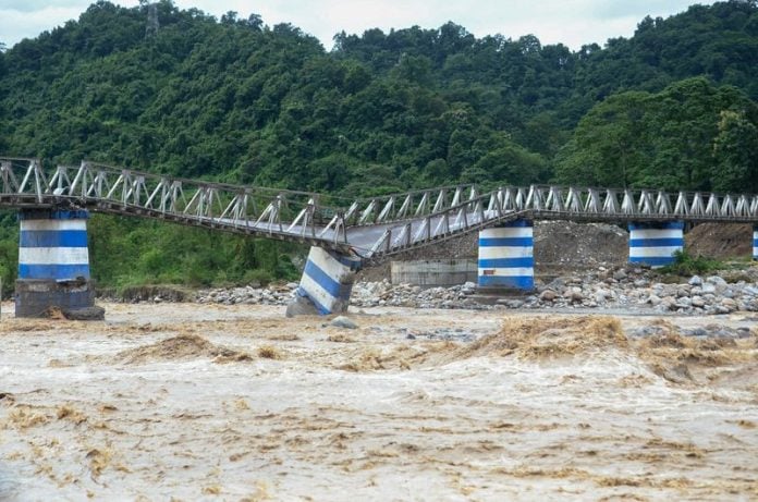 Heavy rains trigger floods, landslides killing 18 in India's Darjeeling ...