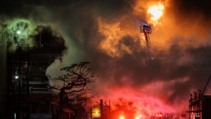 Firefighters work to contain a large fire that broke out at the Chevron refinery, in El Segundo, California, on 2 October 2025. | Daniel Cole | Reuters
