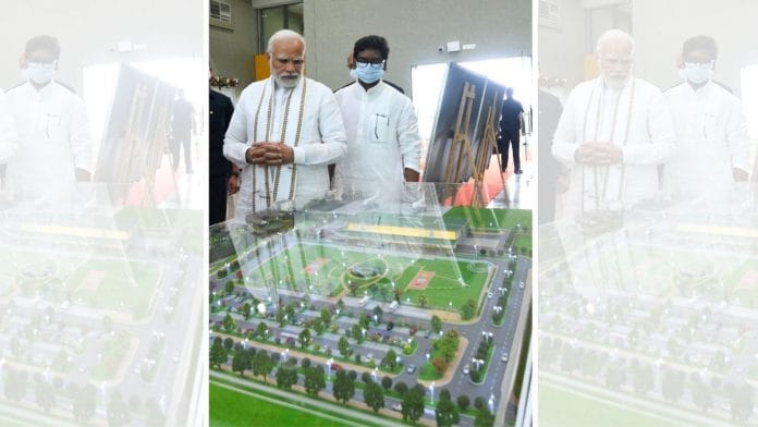 File Photo of PM Modi standing over a replica of Navi Mumbai International Airport | X/@narendramodi