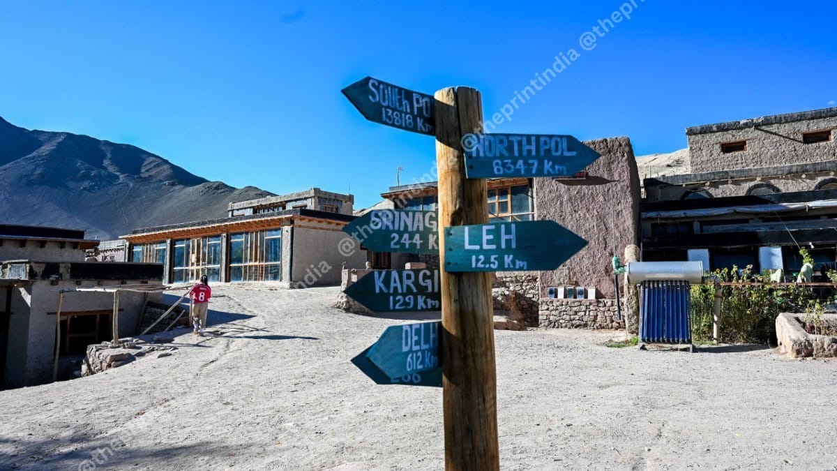 A directional board on SECMOL campus indicating distance to Leh and Kargil | ThePrint/Suraj Singh Bisht