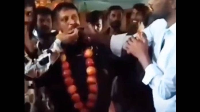 A viral video purportedly shows Gubbachi Seena, accused of murder, garlanded with apples and cutting a cake to celebrate birthday inside Bengaluru’s Parappana Agrahara Central Jail | Screengrab from X