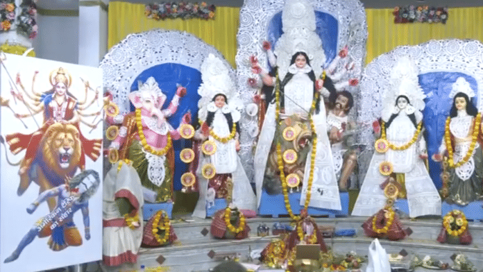 At a Durga Puja pandal in Lucknow, Mahishasurmardini Maa Durga is shown slaying 'American Tariff', which has been depicted as a demon. | Screengrab | ANI