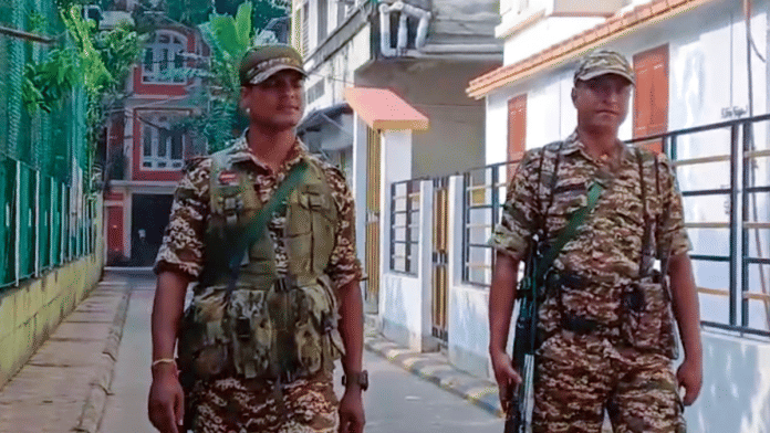 Security personnel keep a vigil during an ED search at a property belonging to West Bengal minister Sujit Bose's close aide in Kolkata on Friday | PTI