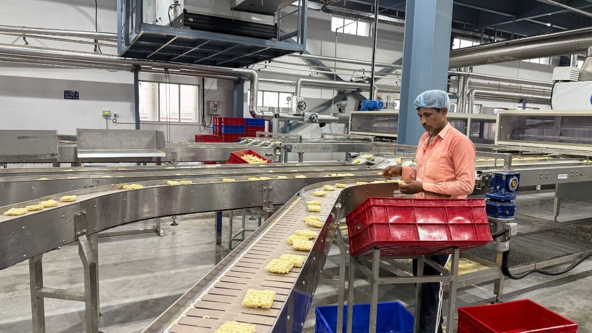 A labourer working in the noodle operations at Sobisco Pvt. Ltd.
