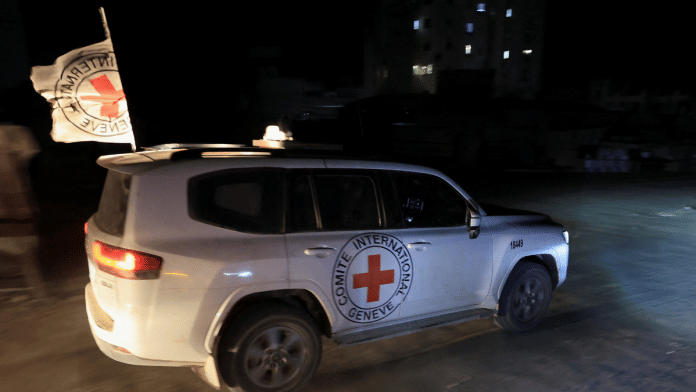 Red Cross transports the body of a deceased hostage, who had been held in Gaza since the deadly October 7, 2023, attack, after it was handed over by Hamas militants as part of a ceasefire and a hostages-prisoners swap deal between Hamas and Israel, in Gaza City, October 27, 2025 | Reuters