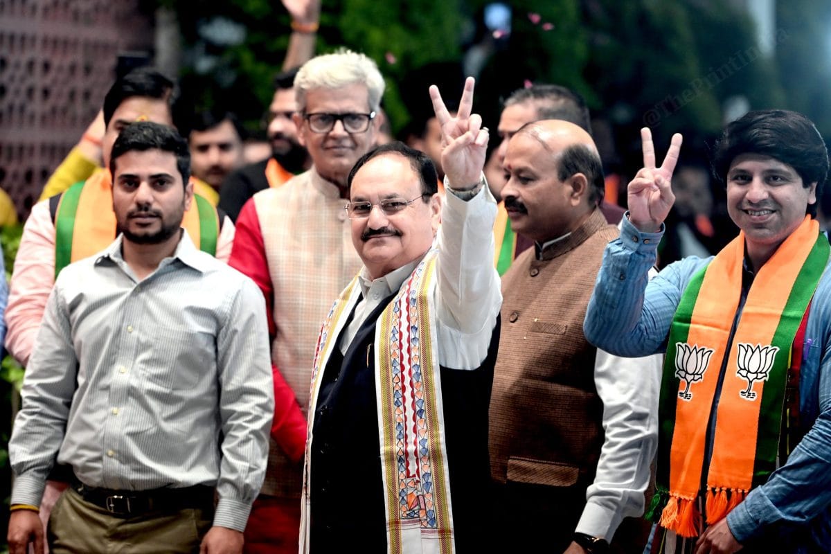BJP National President JP Nadda shows the victory sign to party supporters at the BJP headquarters in Delhi | Suraj Singh Bisht | ThePrint