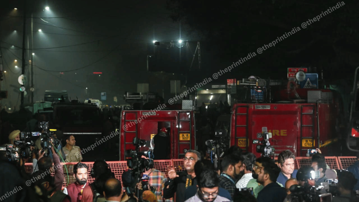 Investigators and media persons near the blast site on the evening of 10 November | Suraj Singh Bisht | ThePrint