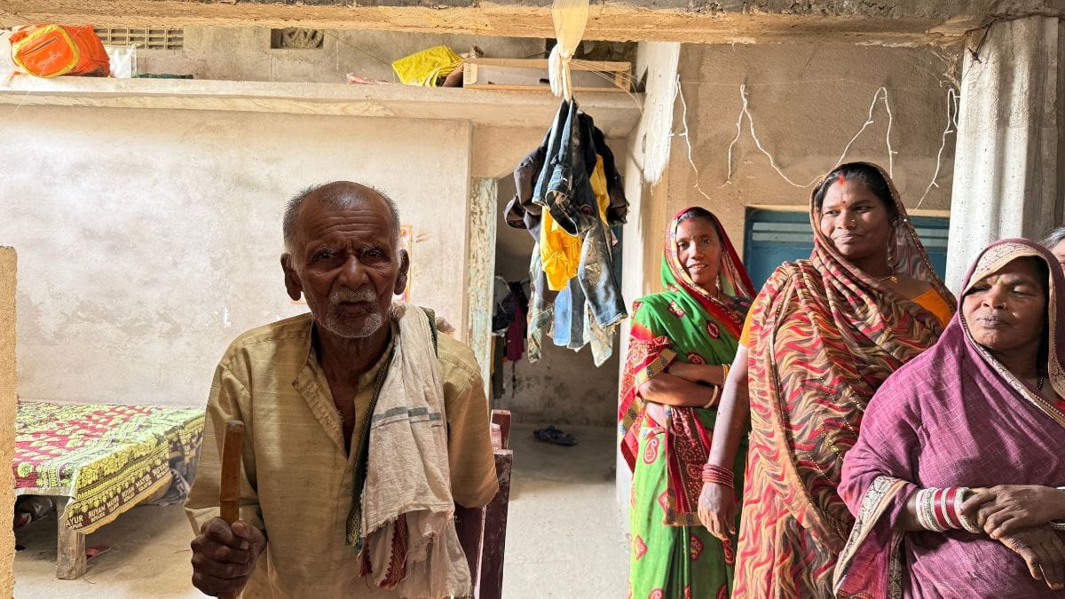 Dilip's father, in his late 80s, stands inside the pucca house that his son built. Dhaneshwar Mukhiya had toiled in others' fields all his life. Photo: Jyoti Yadav, ThePrint