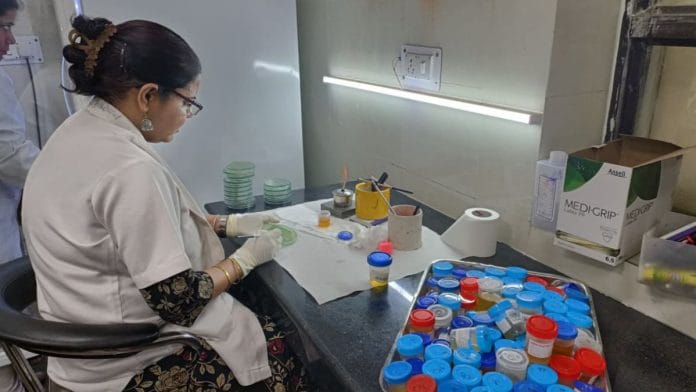 One of the doctors in Lady Hardinge Medical College’s microbiology lab isolates bacteria from urine samples. | Akanksha Mishra | ThePrint