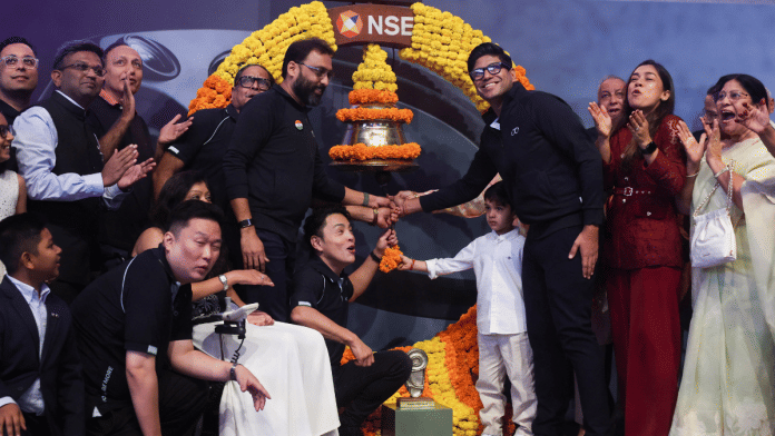 Peyush Bansal, Chief Executive Officer (CEO) of Lenskart Solutions Limited, rings the bell during the listing ceremony of the company's IPO in Mumbai, India, November 10, 2025 | Reuters