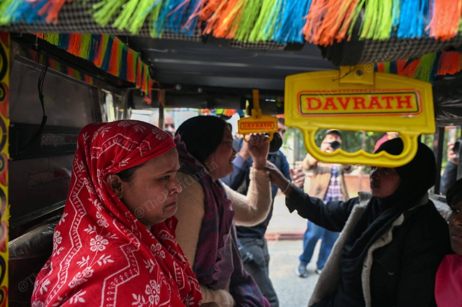 Family members of an e-rickshaw driver, Jumman, who is yet to be found, outside the mortuary at Maulana Azad Medical College | ThePrint/Suraj Singh Bisht