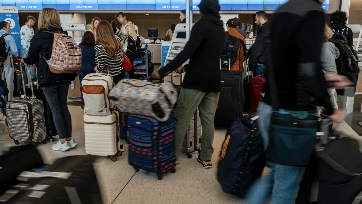 Travelers at San Francisco International Airport in California | Bloomberg
