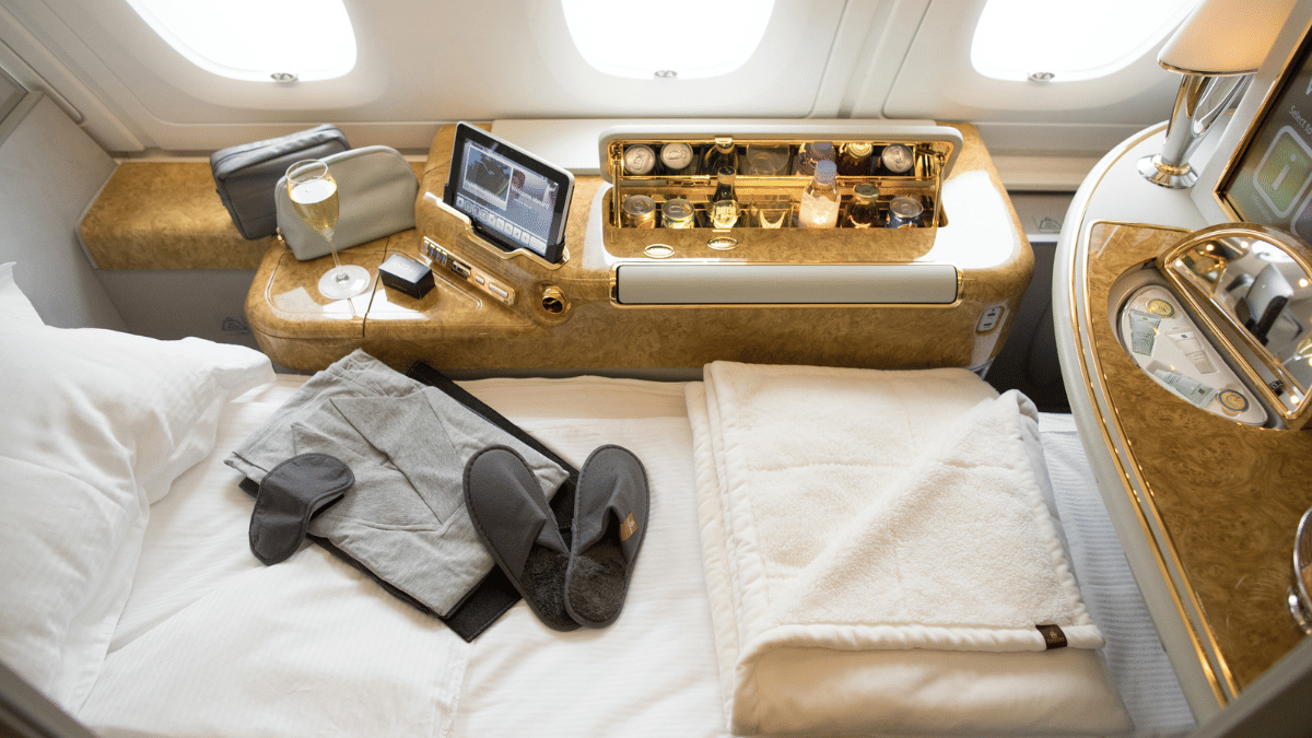 An eye mask, pajamas, and a pair of slippers in an Emirates first-class cabin | Bloomberg
