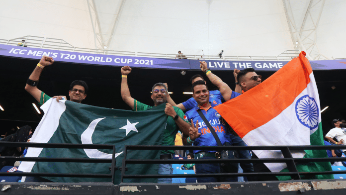 ICC Men's T20 World Cup 2021 - Super 12 - Group 2 - India v Pakistan - Dubai International Stadium, Dubai, United Arab Emirates - October 24, 2021 India and Pakistan fans display their flags in the stand before the match | Reuters