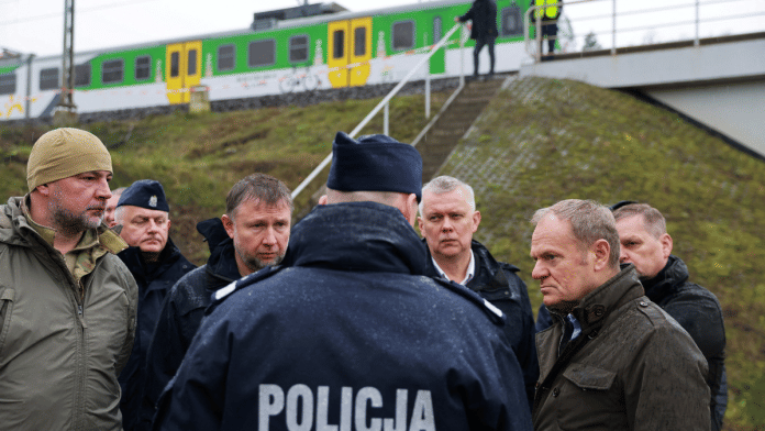 Polish Prime Minister Donald Tusk visits the site of a blast on railway of the Warsaw-Lublin line in Mika, Poland, November 17, 2025 | Handout via Reuters