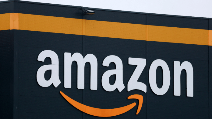 The logo of Amazon is seen at the company's logistics center in Bretigny-sur-Orge, near Paris, France, November 28, 2025 | Reuters