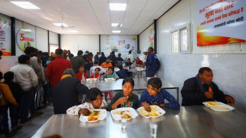 Children eat a meal at the canteen in Nehru Nagar. Manisha Mondal | ThePrint