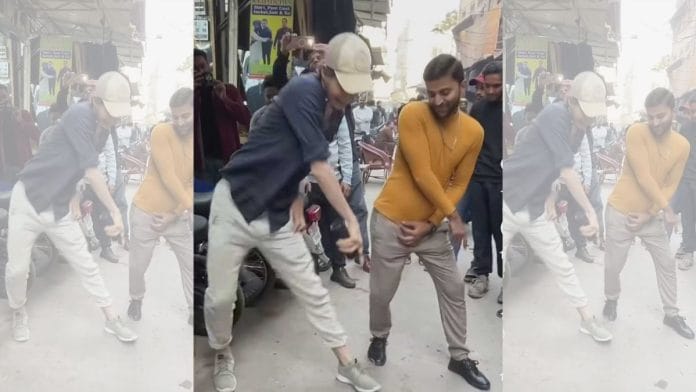 Edouard Jacqmin dancing with a Pakistani man in one of his videos