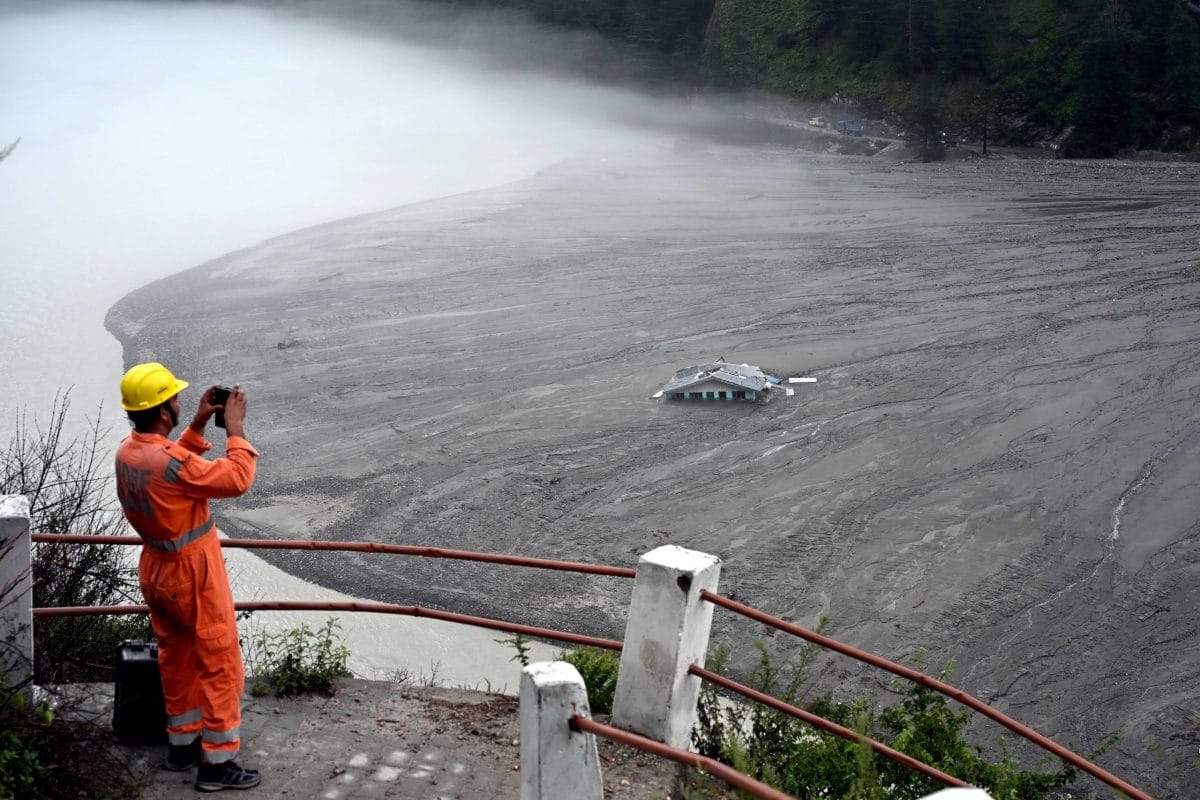 NDRF personnel taking pictures of Dharali | Suraj Singh Bisht | ThePrint