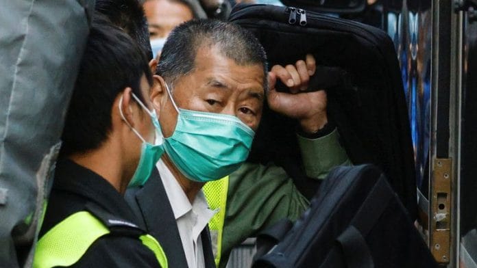 Media tycoon Jimmy Lai, founder of Apple Daily, looks on as he leaves the Court of Final Appeal by prison van, in Hong Kong on 1 February 2021. | Tyrone Siu | Reuters