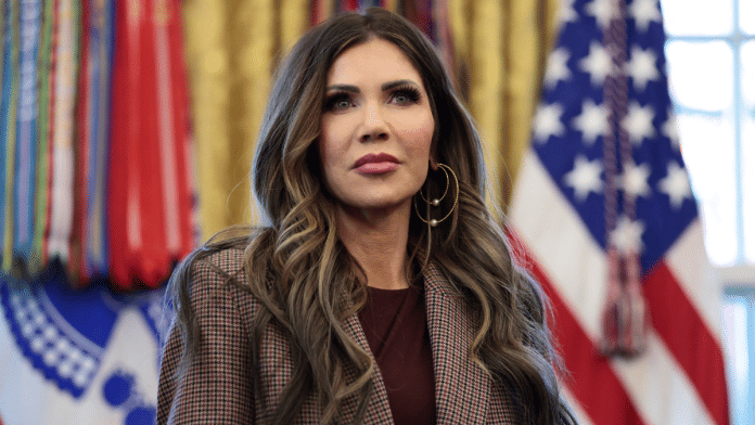 U.S. Homeland Security Secretary Kristi Noem looks on as U.S. President Donald Trump (not pictured) meets with the White House Task Force on the FIFA World Cup 2026 in the Oval Office at the White House in Washington, D.C., U.S., November 17, 2025 | Reuters