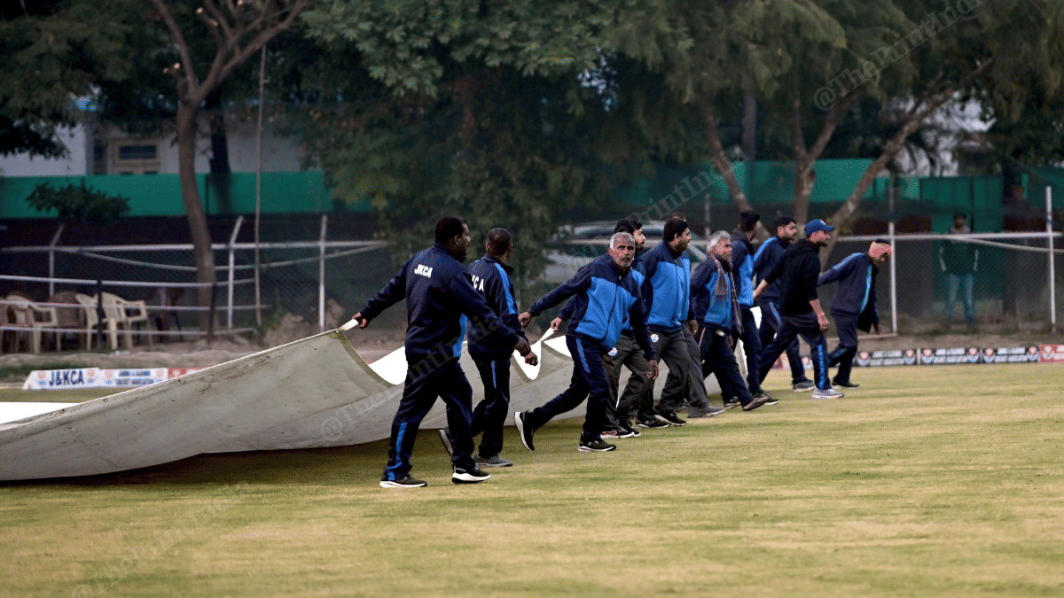 Ground staff on their way to cover the pitches at Jammu’s GGM Science College ground | Suraj Singh Bisht | ThePrint