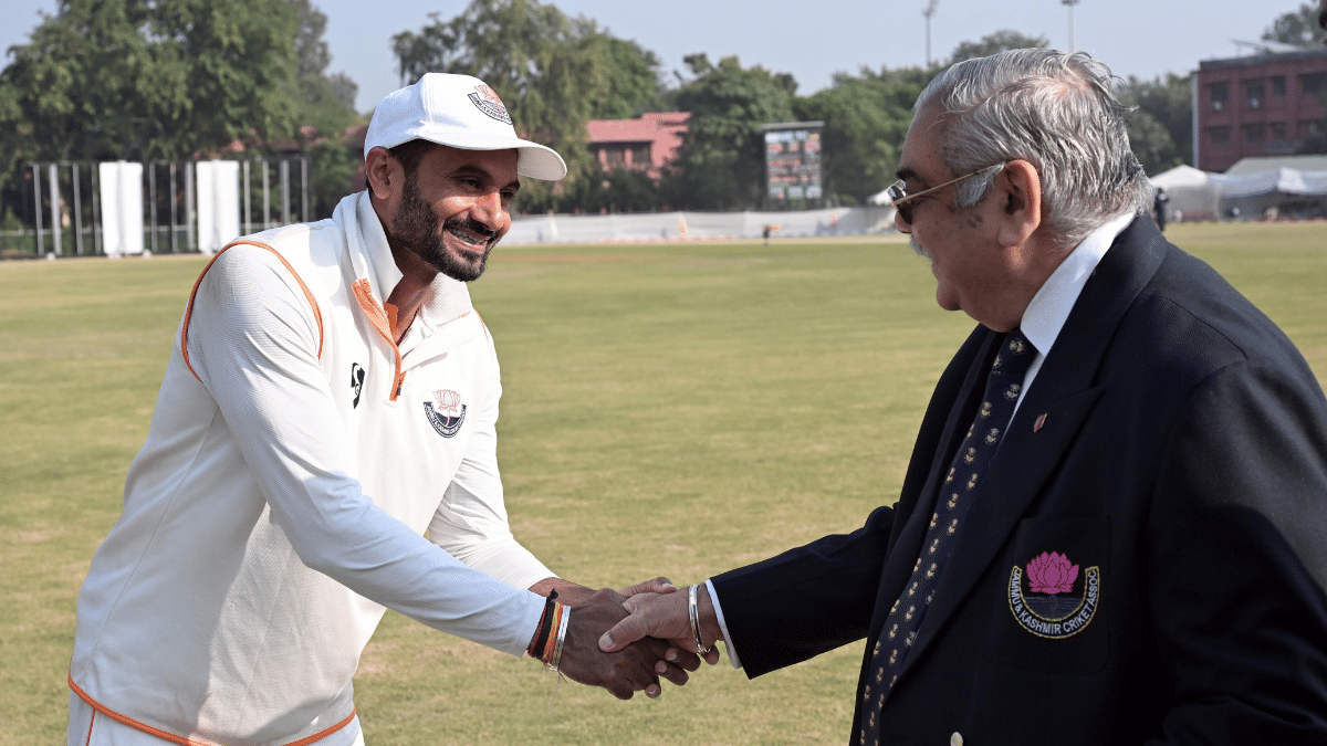 Dogra exchanges pleasantries with JKCA member Brigadier Anil Gupta (retired) after a match | Suraj Singh Bisht | ThePrint