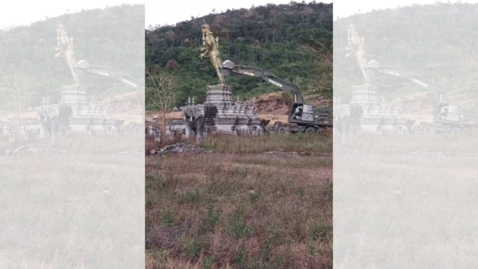 Still from video of Vishnu statue being demolished