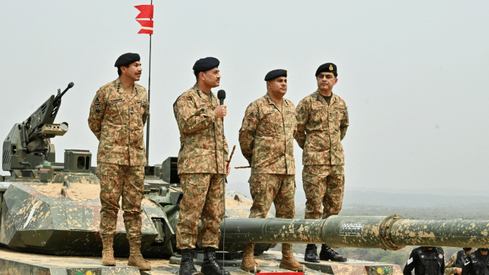 Chief of Army Staff of Pakistan Asim Munir holds a microphone during his visit at the Tilla Field Firing Ranges (TFFR) to witness the Exercise Hammer Strike, a high-intensity field training exercise conducted by the Pakistan Army's Mangla Strike Corps, in Mangla, Pakistan May 1, 2025. Inter-Services Public Relations (ISPR) | File photo | Pool via Reuters