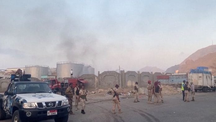 Smoke rises in the aftermath of a Saudi-led coalition airstrike, which targeted what it described as foreign military support to UAE-backed southern separatists, in Yemen's southern port of Al-Mukalla, in this screengrab from a handout video obtained by Reuters on December 30, 2025 | SABAA TV/Handout via REUTERS