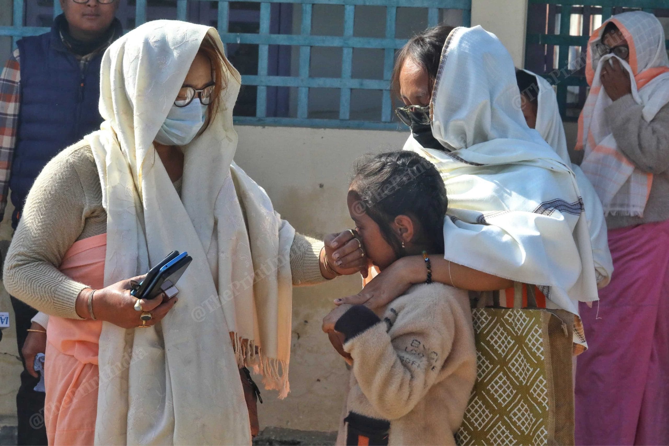M. Rishikanta's family members console the child. | Praveen Jain/ThePrint
