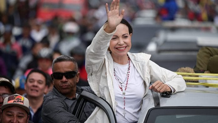 Venezuelan opposition leader Maria Corina Machado greets supporters during a campaign rally for the presidential election, in Merida state, Venezuela June 25, 2024 | Reuters