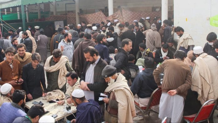 Residents from Tirah valley, who fled a remote mountainous region bordering Afghanistan, gather to get themself registered, in Bara, Khyber District of Khyber Pakhtunkhwa province, Pakistan, January 30, 2026. REUTERS/Muhammad Amin Afridi