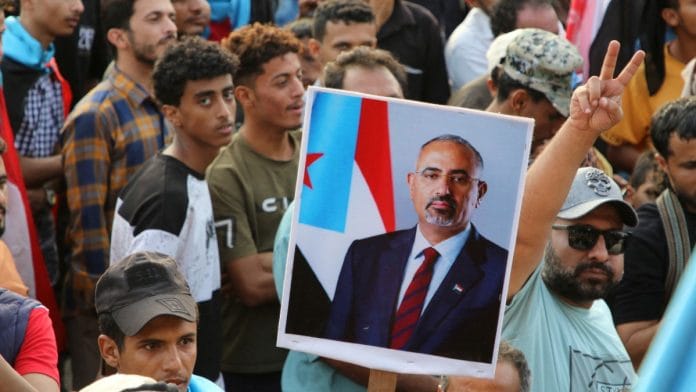 Supporters of UAE-backed STC hold a poster of Aidarous al-Zubaidi in Aden, Yemen on 21 December 21 2025 | Reuters/Fawaz Salman
