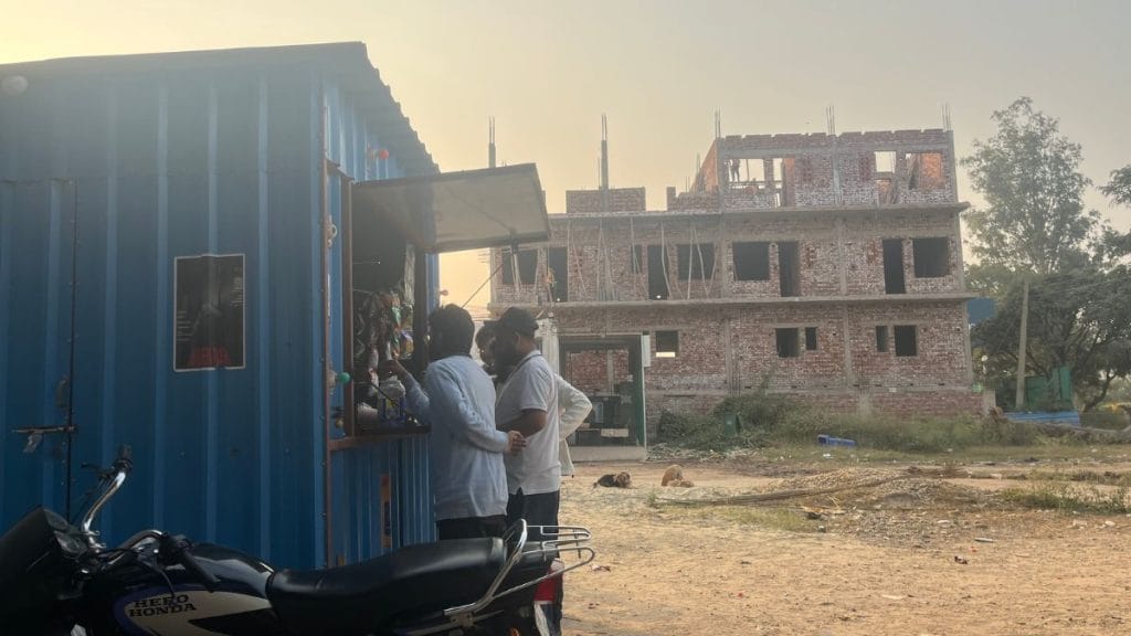 Students gather to smoke outside, on an abandoned plot of land. Antara Baruah | ThePrint