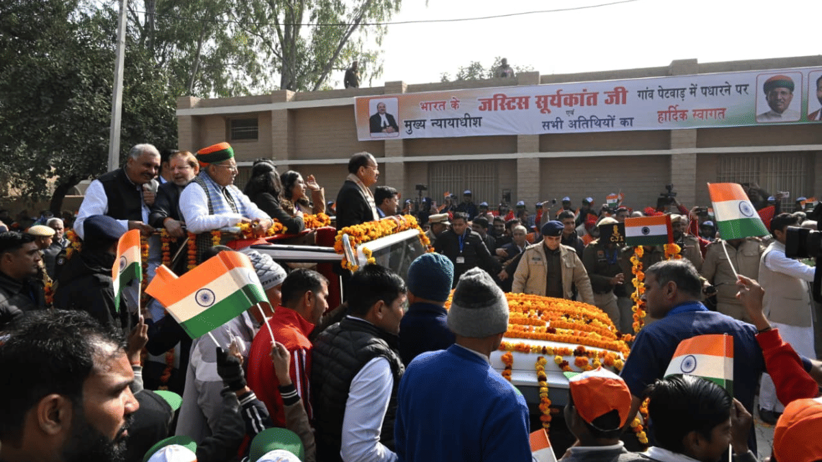 CJI Surya Kant at his native village with Union minister Arjun Ram Meghwal. | X/@arjunrammeghwal