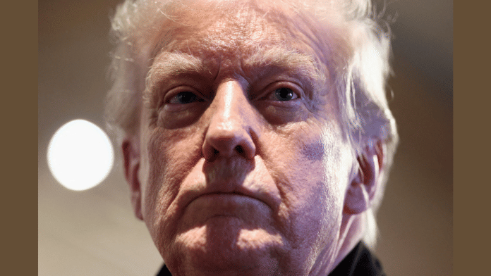 U.S. President Donald Trump looks on as he visits Machine Shed restaurant in Urbandale, Iowa, U.S., January 27, 2026 | Reuters