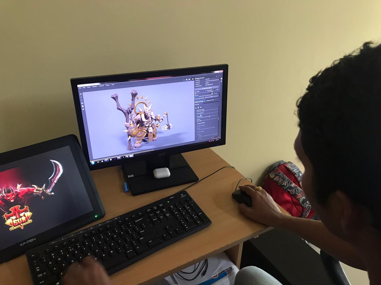 A developer works on a stone sculpture game model of Yama, which can be found in Ogre Head Studio's upcoming game Yodha. | By special arrangement