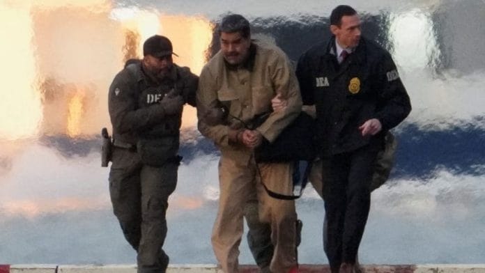 Captured Venezuelan President Nicolas Maduro is escorted, as he heads towards the Daniel Patrick Moynihan United States Courthouse in Manhattan in New York City, on 5 January 2026 | Adam Gray | Reuters