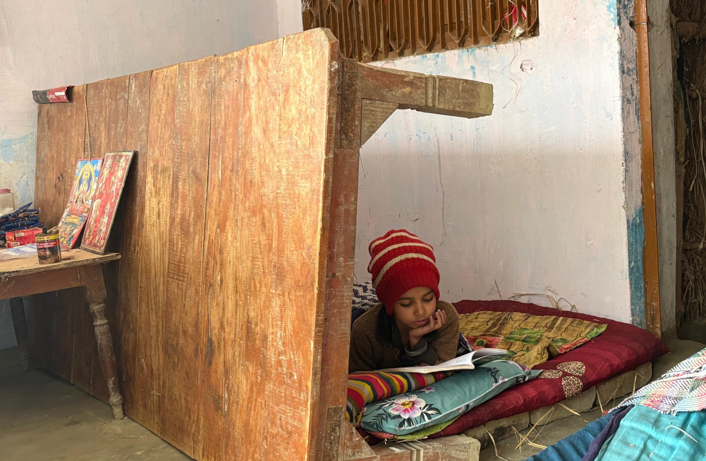 Shivani studying from her hindi textbook.