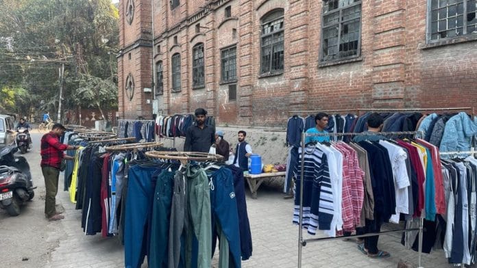 Descendants of the mills workers sell clothes outside Lal Imli, continuing the work their fathers were once engaged in | Udit Hinduja | ThePrint