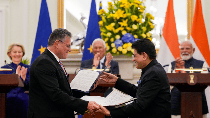 Union Commerce and Industry Minister Piyush Goyal and European Commissioner for Trade Maros Sefcovic exchange documents after a meeting between Prime Minister Narendra Modi, European Council President Antonio Costa and European Commission President Ursula von der Leyen, at the Hyderabad House in New Delhi | PTI