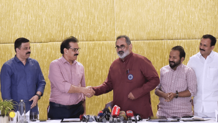 Sabu M Jacob of Twenty20 shakes hands with BJP state chief Rajeev Chandrasekhar at a joint press conference in Thiruvananthapuram | X/@RajeevRC_X
