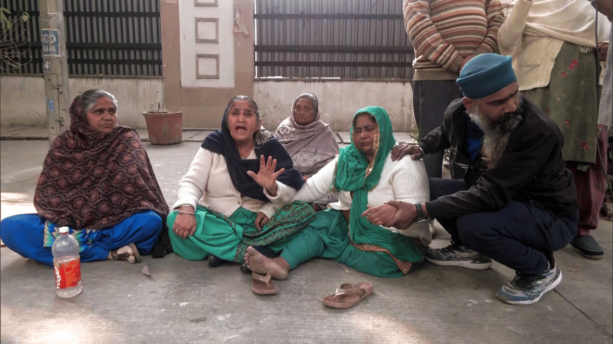 Family members of 1984 anti-Sikh riots victims outside Rouse Avenue Court as judge acquits former Congress MP Sajjan Kumar. | ANI Video Grab
