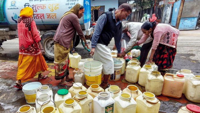 People fill water from a tanker after hundreds fell ill due to contamination of the drinking water supply line in Bhagirathpura, Indore | PTI