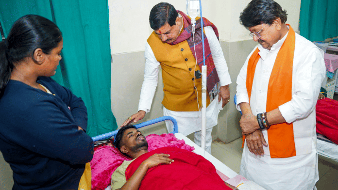 Madhya Pradesh Chief Minister Mohan Yadav and Minister Kailash Vijayvargiya meet a man being treated for suspected water contamination at a hospital in Indore | Mohan Yadav/X via PTI