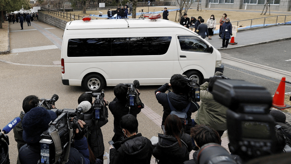 A van believed to be carrying Tetsuya Yamagami arrives for a trial at the Nara District Court on 28 October 2025. | Kyodo via REUTERS